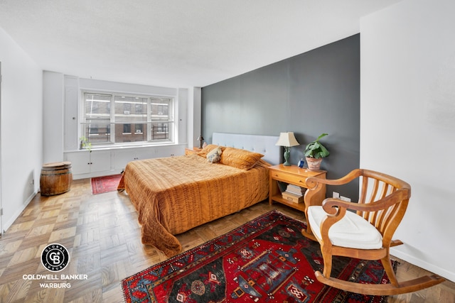 bedroom featuring light parquet floors