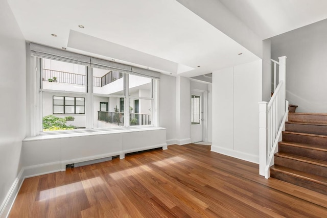 walk in closet with dark hardwood / wood-style flooring