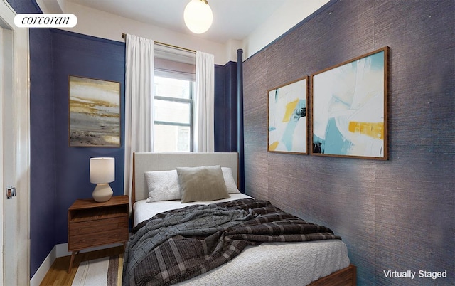 bedroom featuring hardwood / wood-style floors