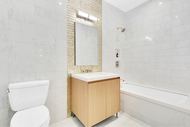 full bath featuring tile walls, shower / bath combination, toilet, and vanity