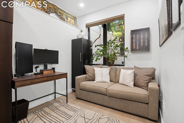 living room with light hardwood / wood-style floors