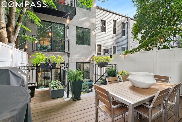 wooden terrace featuring area for grilling