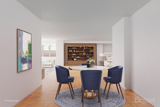 dining space featuring light parquet floors