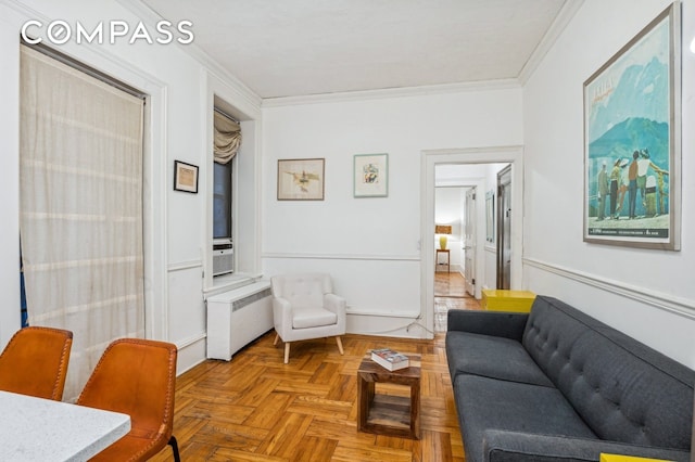 living room featuring ornamental molding and radiator heating unit