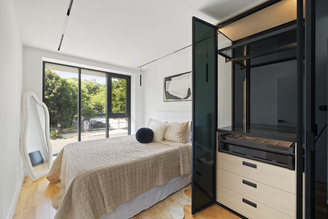 bedroom with light hardwood / wood-style floors