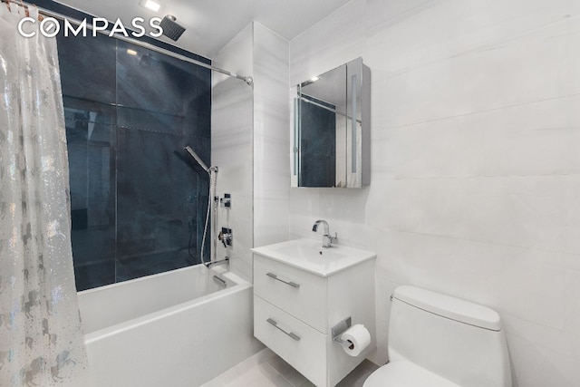 full bathroom featuring shower / bath combo with shower curtain, vanity, toilet, and tile walls