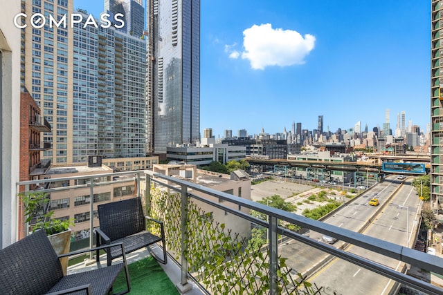 balcony featuring a city view