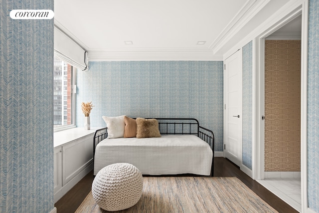 bedroom with ornamental molding and wood-type flooring