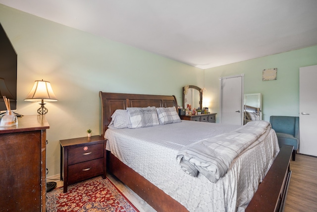 bedroom featuring wood finished floors