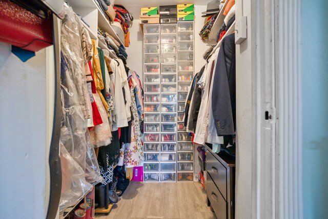 spacious closet with wood finished floors