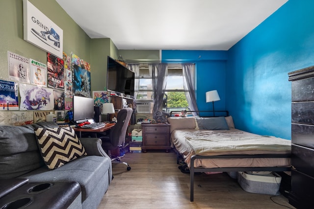 bedroom featuring wood finished floors