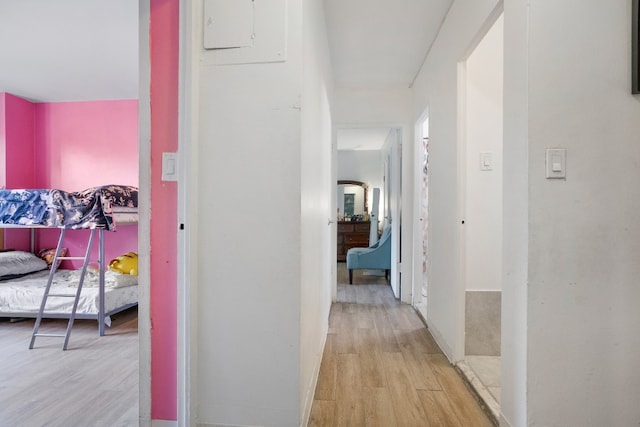 corridor with light hardwood / wood-style flooring