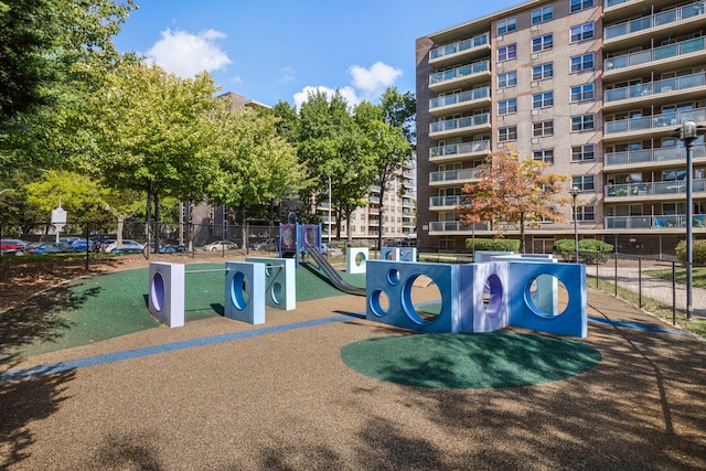 view of home's community featuring fence