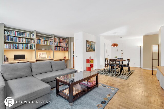 living room featuring baseboards