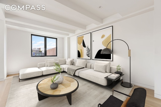 living room featuring beamed ceiling, light wood-style flooring, and baseboards