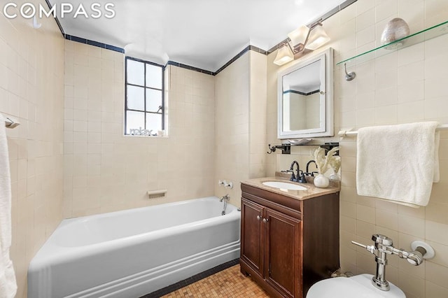 bathroom with tiled shower / bath, tasteful backsplash, tile walls, vanity, and tile patterned floors