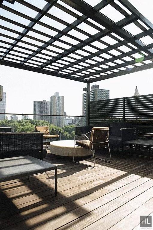 wooden terrace featuring a pergola