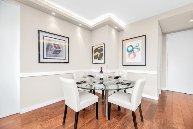 dining area with hardwood / wood-style floors