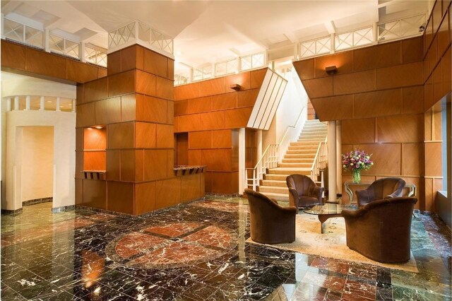 bathroom with shower with separate bathtub, tasteful backsplash, and vanity