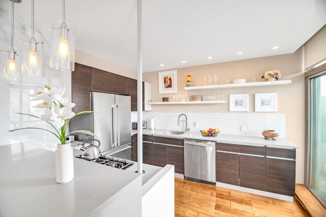 dining area featuring high vaulted ceiling, parquet flooring, french doors, and a healthy amount of sunlight