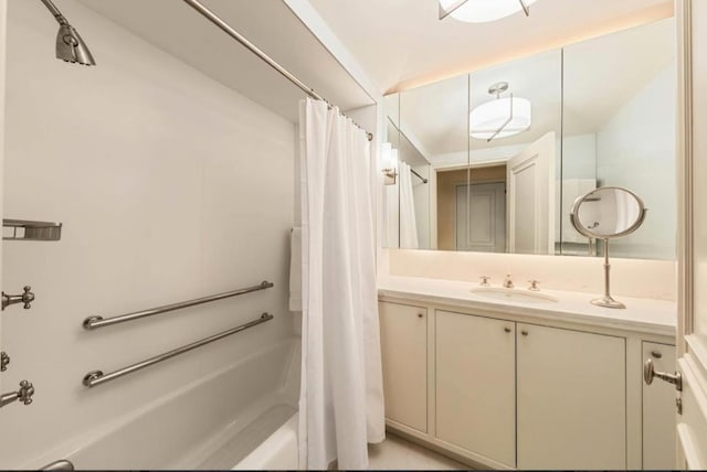 bathroom with shower / bath combo and vanity