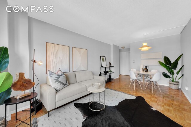 living room with parquet flooring