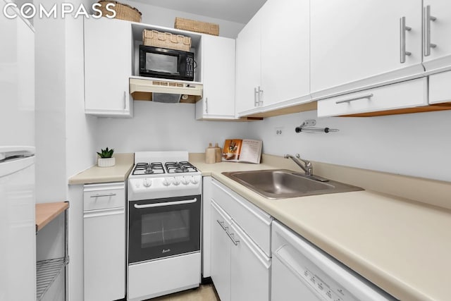 kitchen with sink, white appliances, and white cabinets