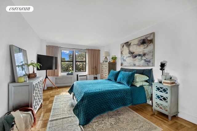 bedroom with baseboards and visible vents