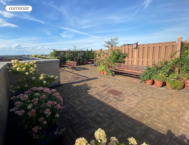 view of patio featuring fence