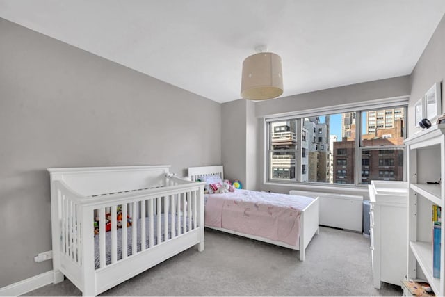 bedroom featuring light colored carpet