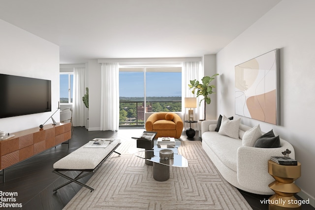 living area featuring wood finished floors and baseboards