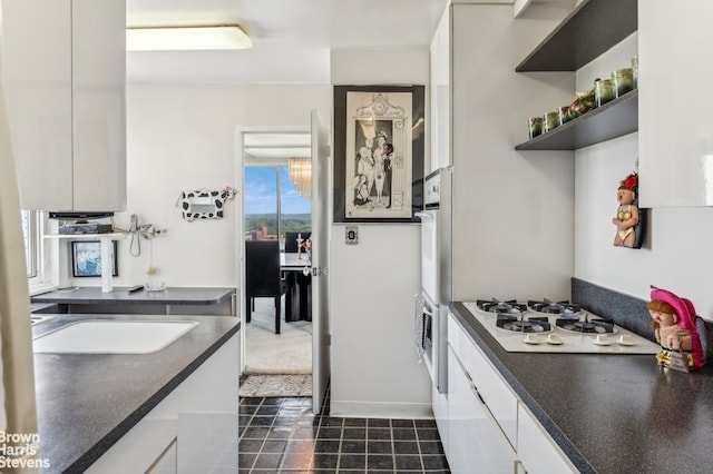 kitchen with white cabinets and sink