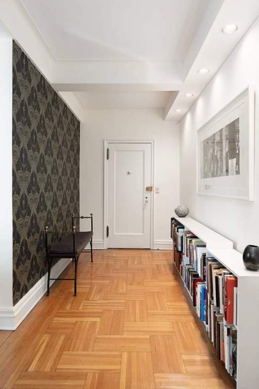 hallway featuring light parquet flooring