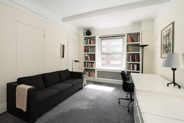 office area featuring beamed ceiling and dark carpet