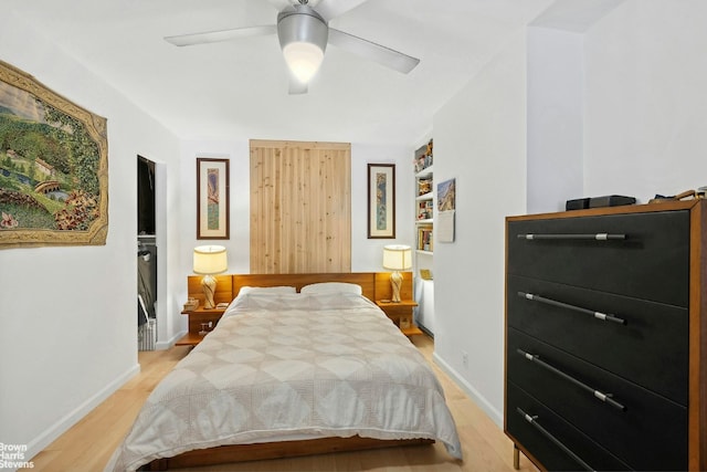 bedroom featuring ceiling fan and light hardwood / wood-style flooring