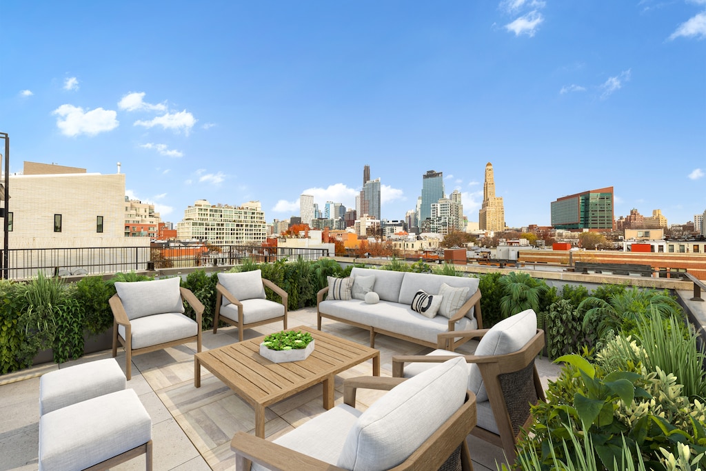 view of patio / terrace featuring an outdoor hangout area and a city view