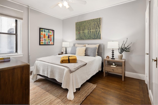 bedroom featuring ceiling fan, baseboards, wood finished floors, and ornamental molding