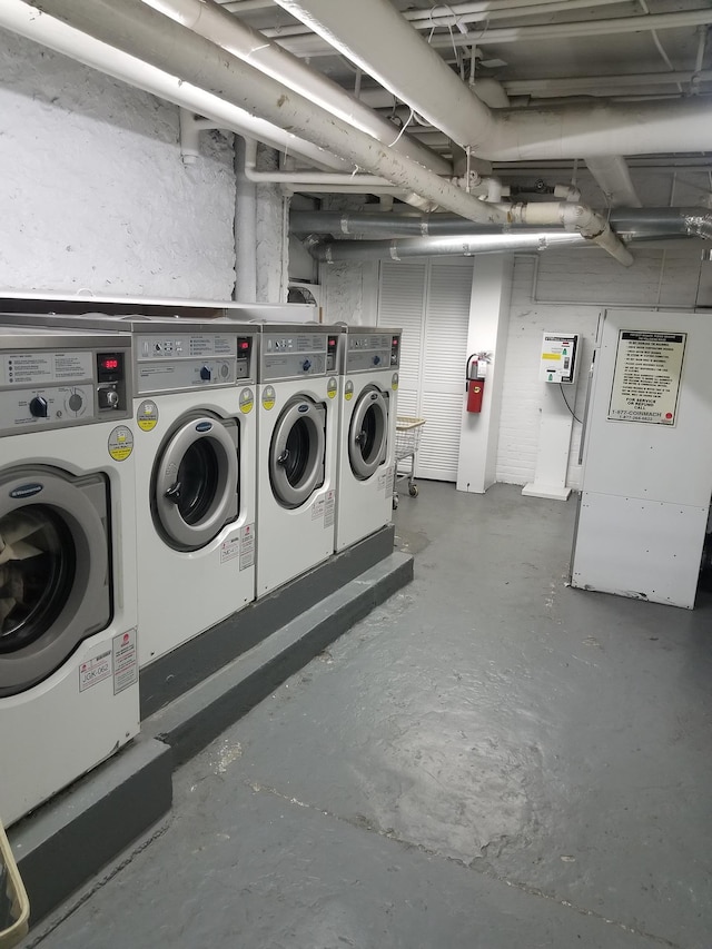 unfinished basement featuring independent washer and dryer