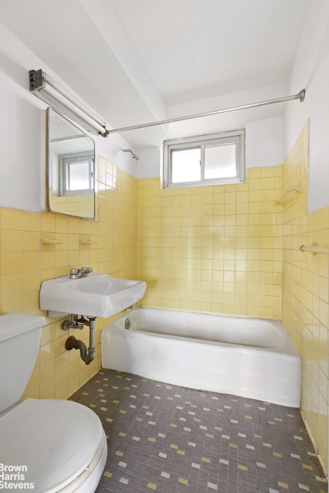 185 Park Row Unit 12E, New York City, NY 10038 - bathroom with tile walls and shower / tub combination
