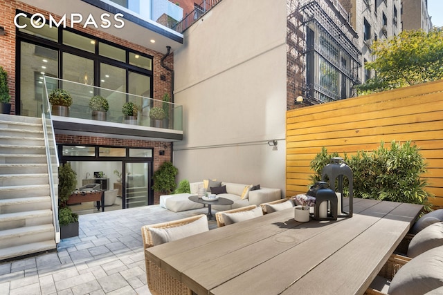 view of patio / terrace featuring fence and an outdoor living space