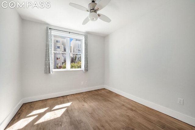 unfurnished room with light hardwood / wood-style floors and ceiling fan