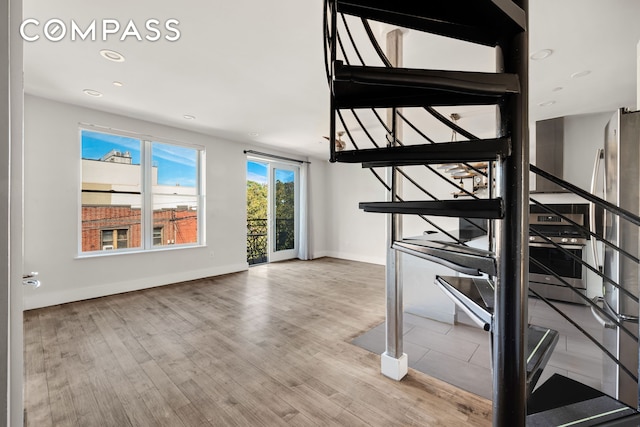 252 Richardson St Unit 3L, New York City, NY 11222 - stairs featuring wood finished floors, baseboards, and recessed lighting