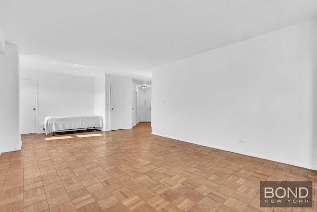 spare room featuring light parquet floors