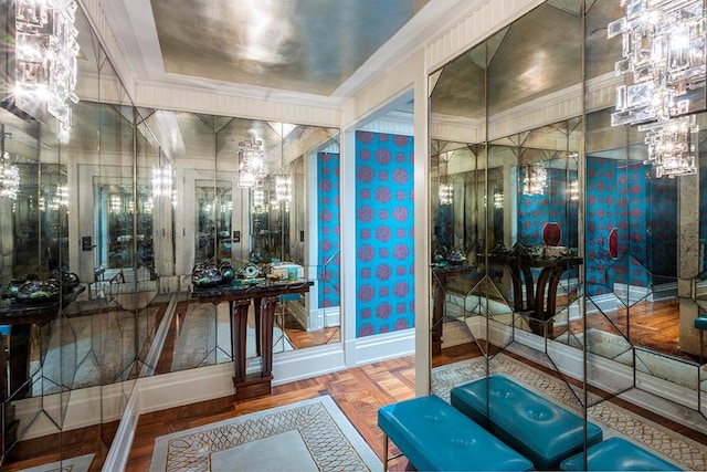 bathroom with parquet floors, baseboards, and an inviting chandelier