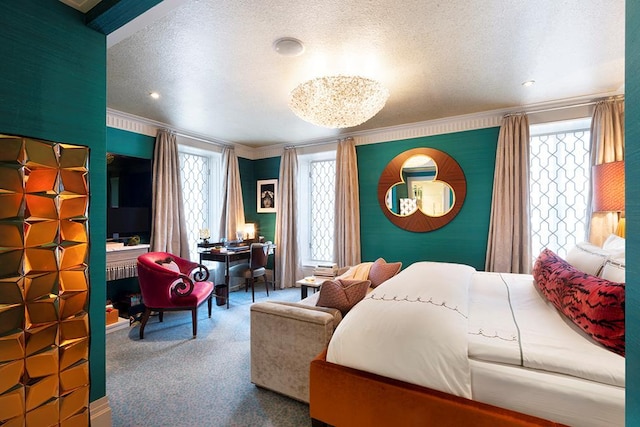 carpeted bedroom with multiple windows, a textured ceiling, and crown molding