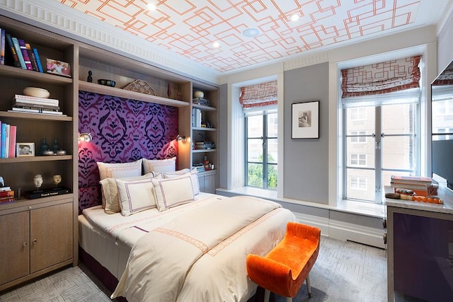 bedroom with an ornate ceiling and ornamental molding