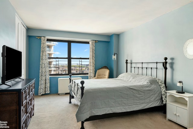 bedroom featuring light carpet