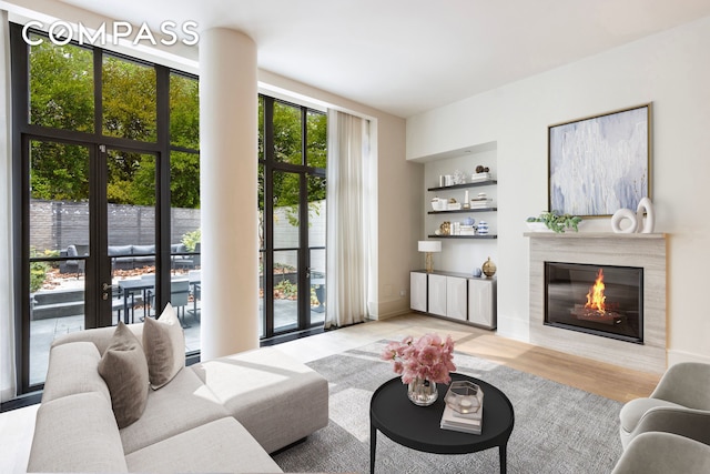 215 Sullivan St Unit Thc, New York City, NY 10012 - living room with a glass covered fireplace and wood finished floors