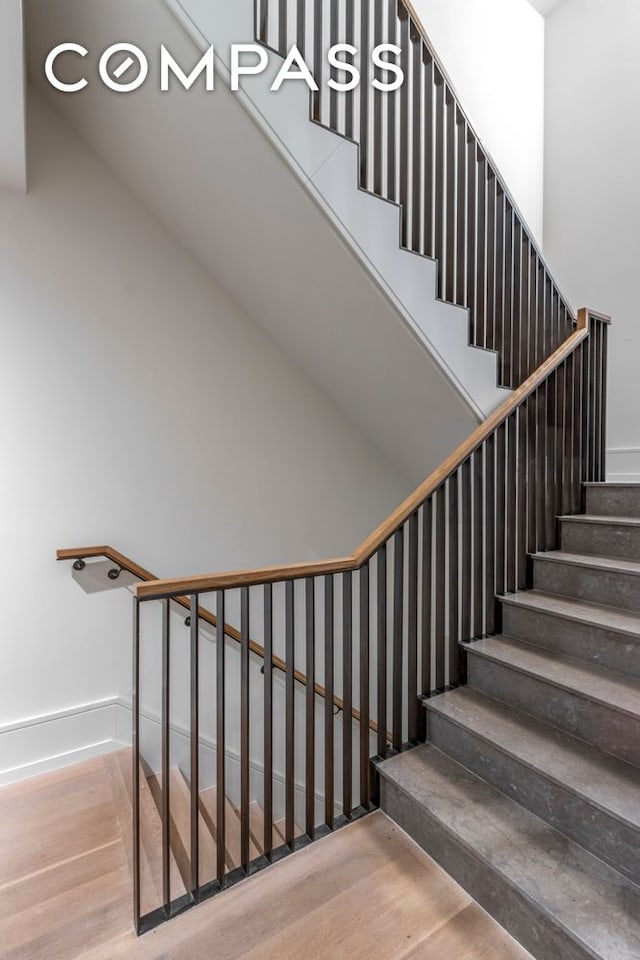 215 Sullivan St Unit Thc, New York City, NY 10012 - staircase featuring wood finished floors and baseboards