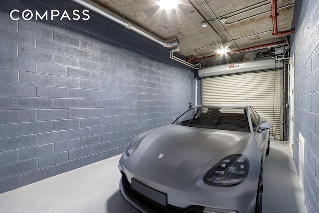 garage featuring concrete block wall